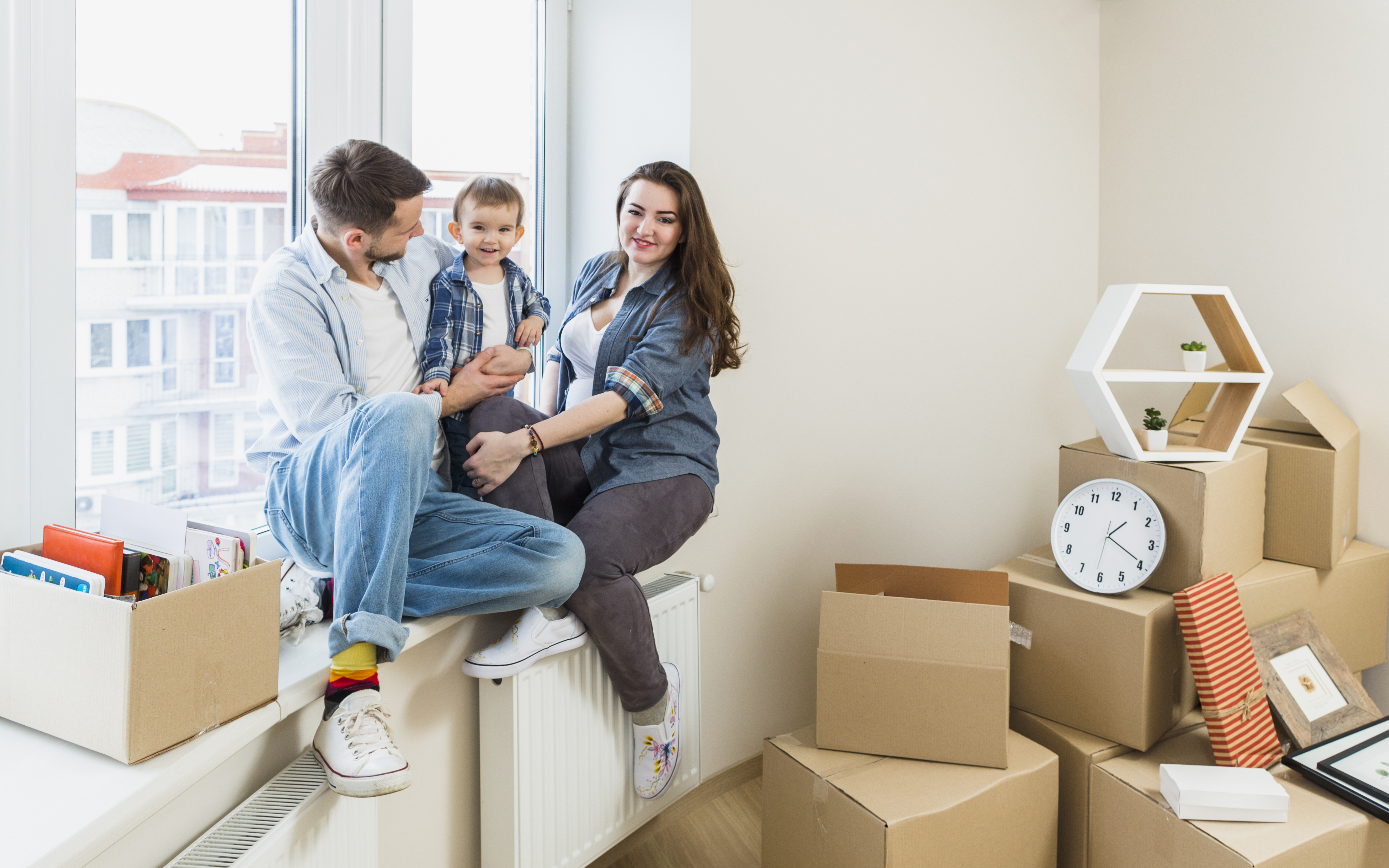 A family sitting in there new home