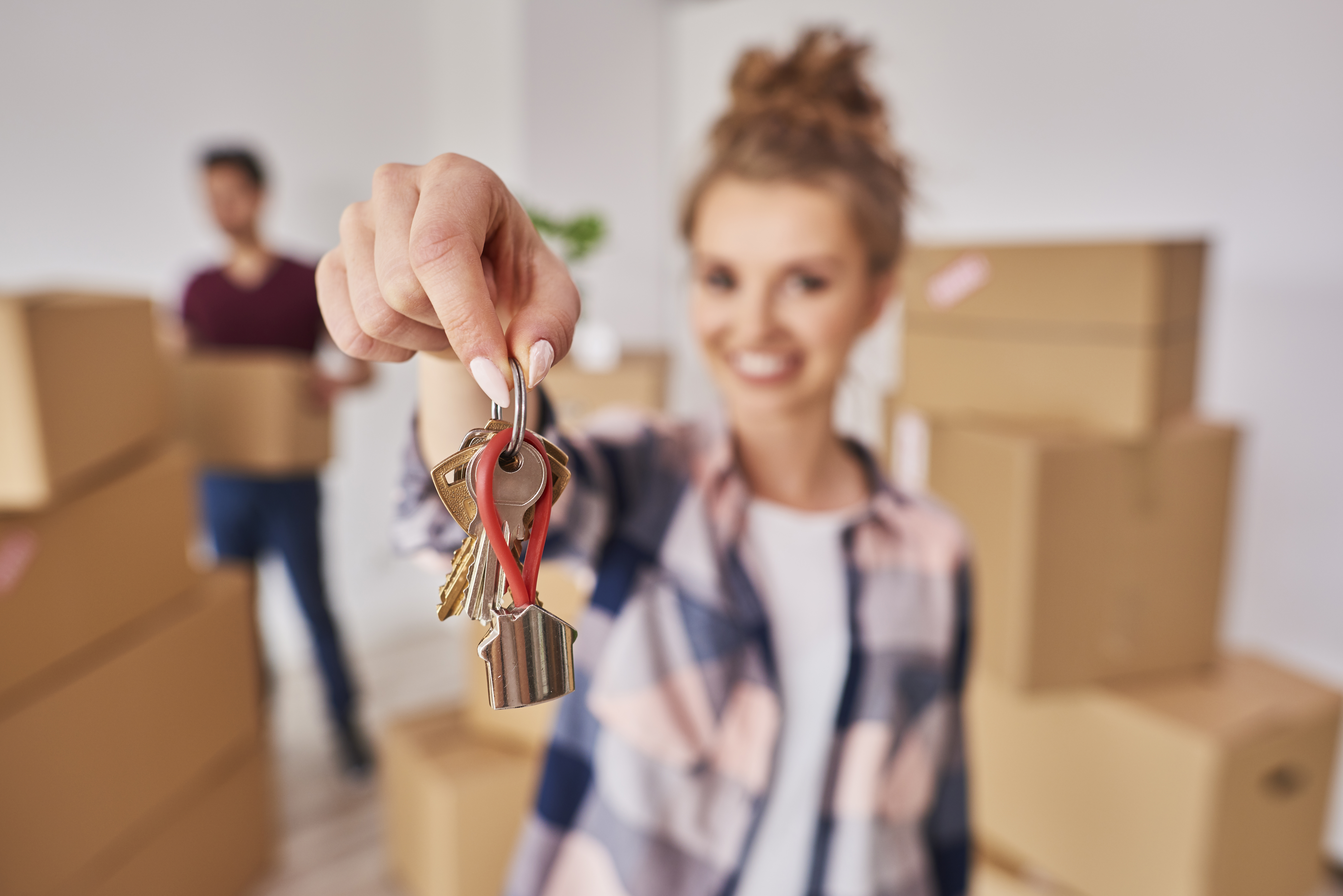 A Women Holding keys To Her Home