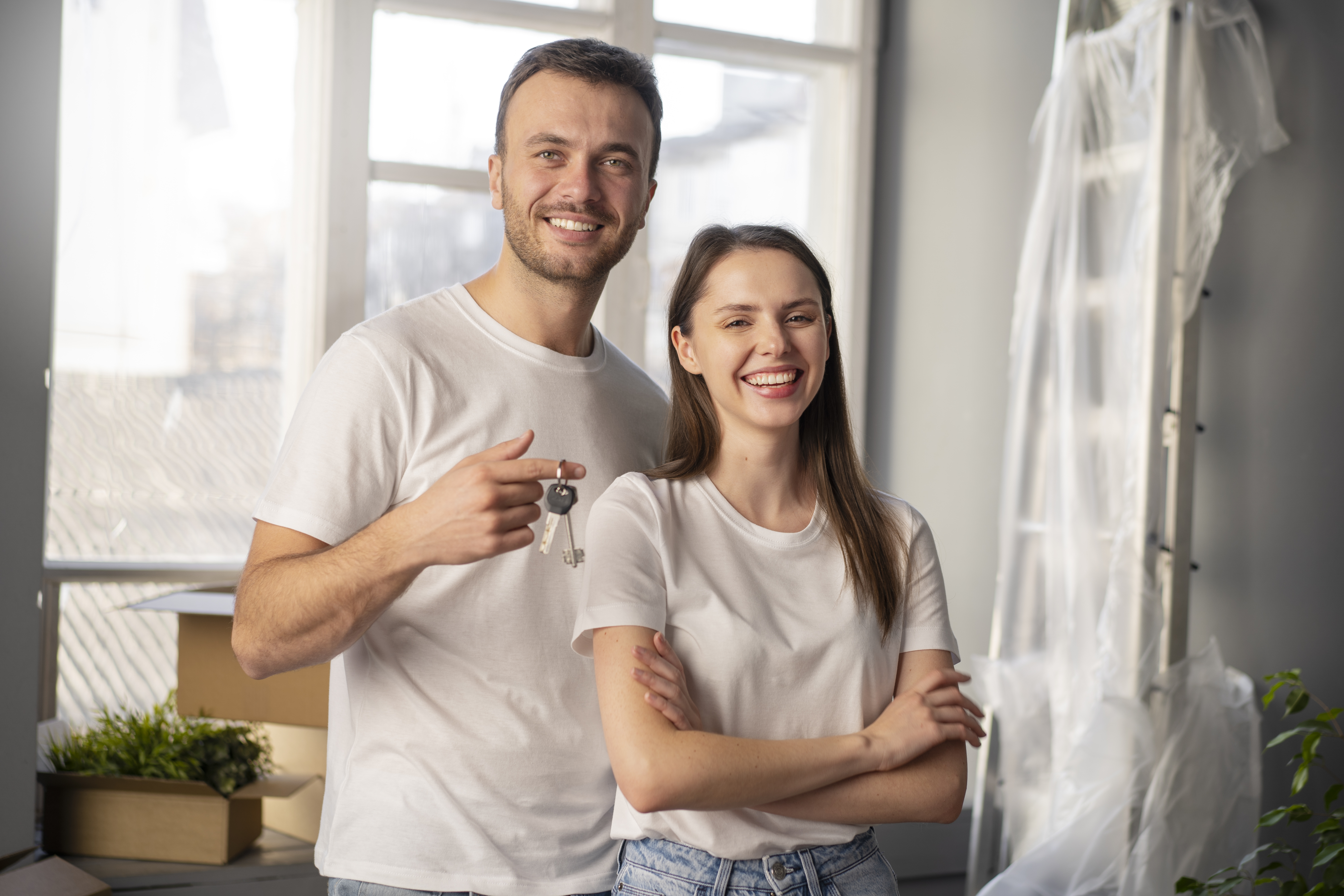 A couple standing happy in there new house
