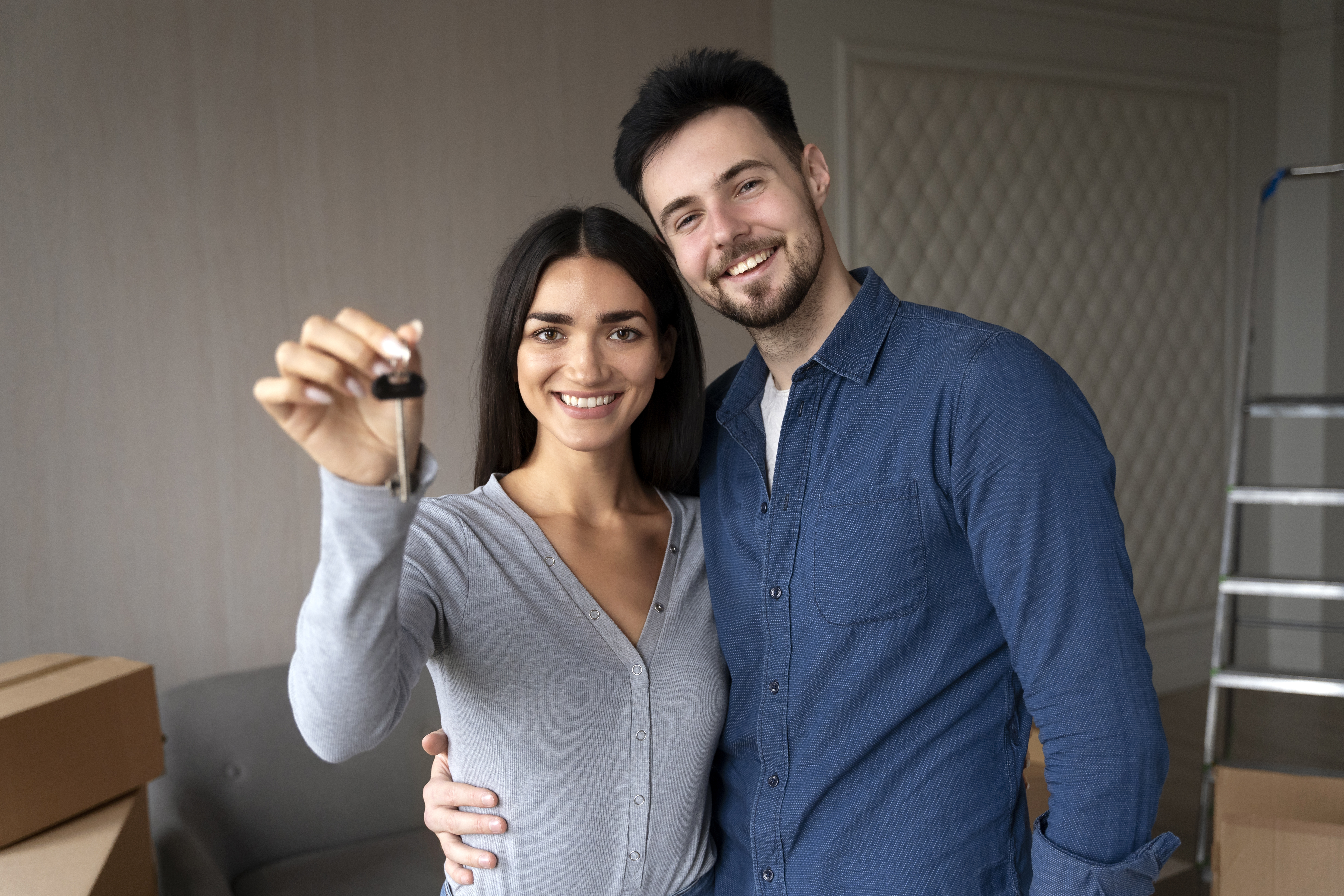 A women and a man cuddling in there new house