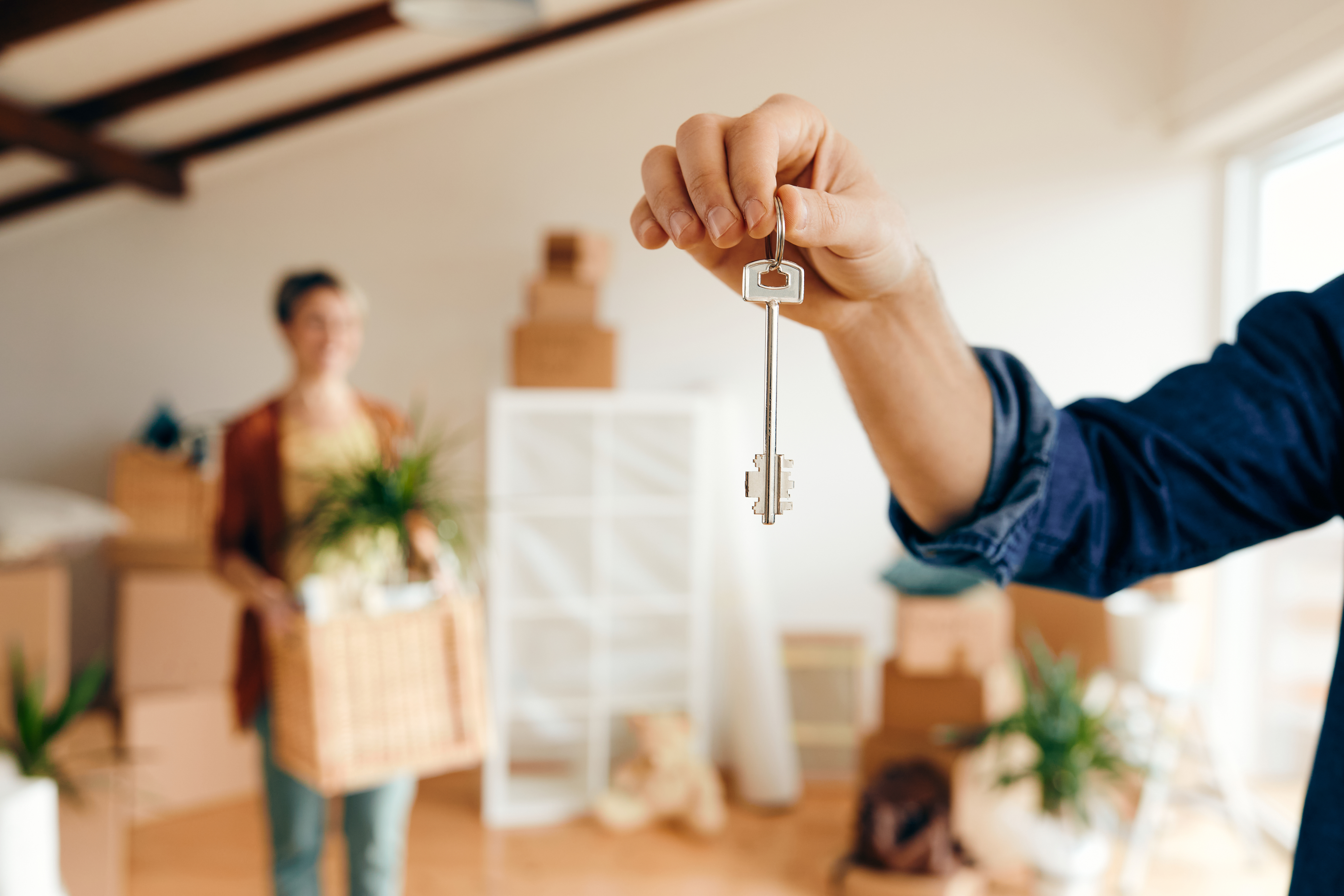 A man holding the keys to the new home